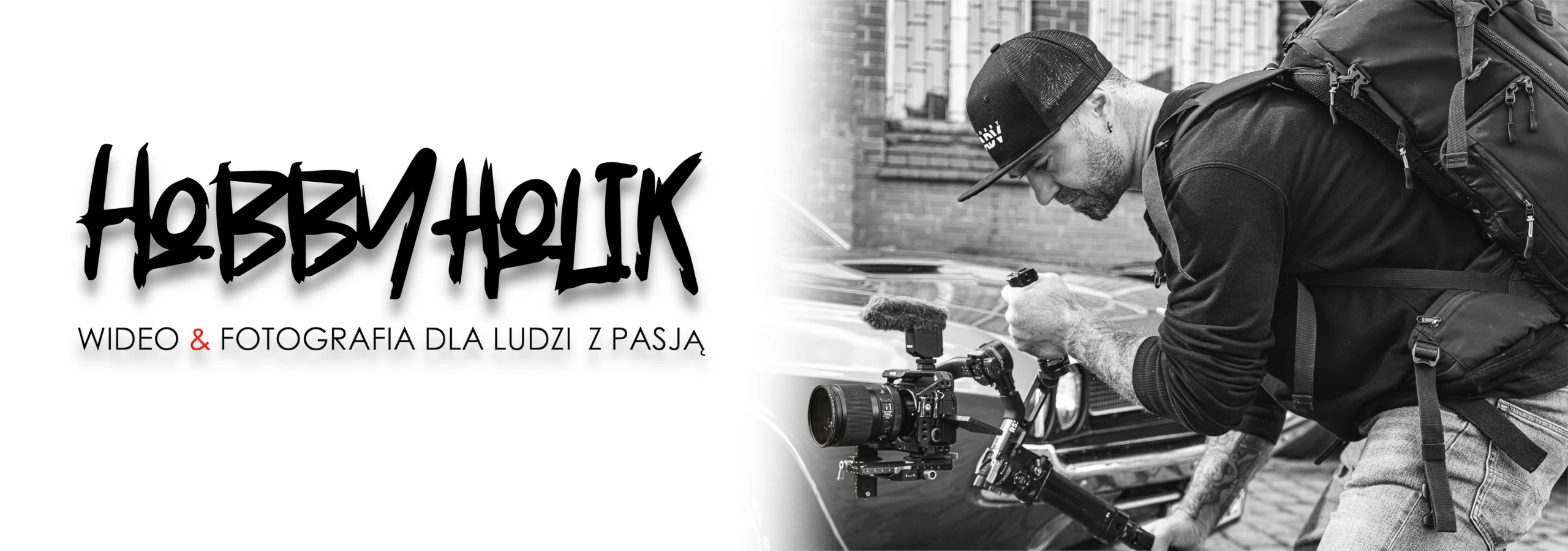 fotograf z aparatem napis hobbyholik